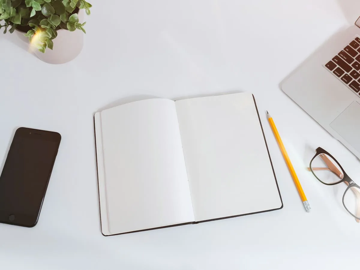 A notebook and study materials on a desk